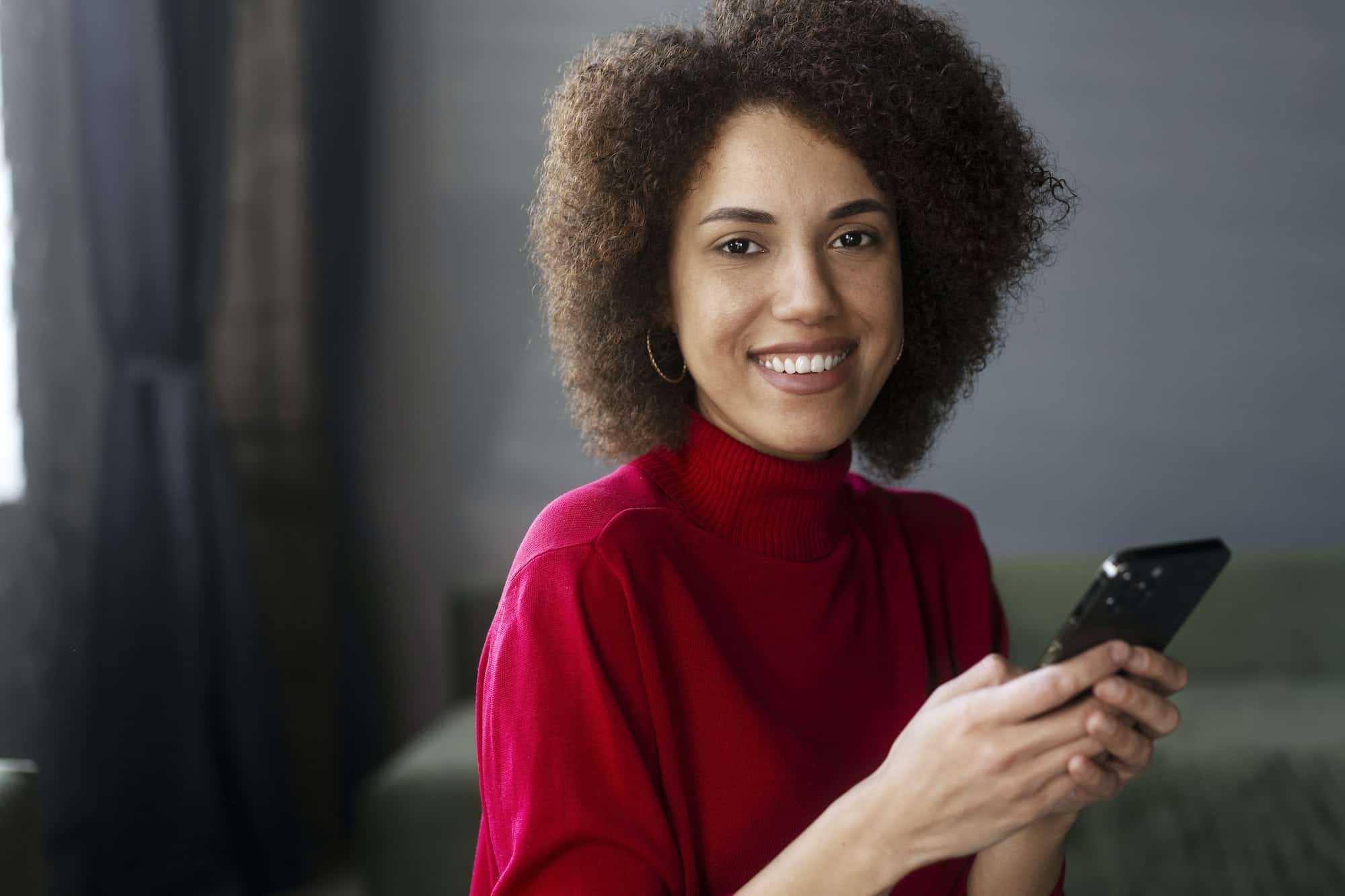 Customer using a mobile phone to browse a product catalogue