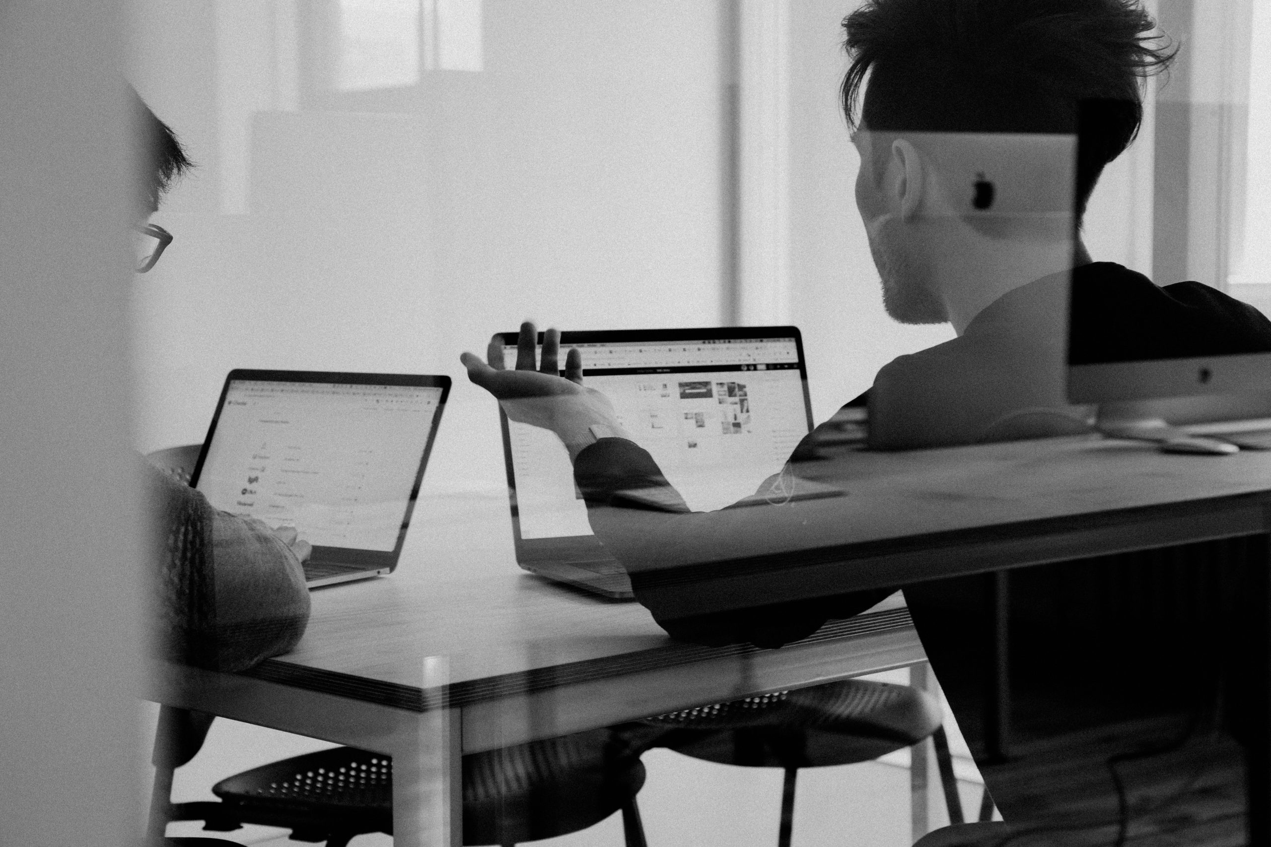 Colleague working at a desk during a project review