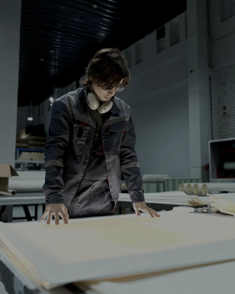 Factory floor · operator checking a panel, application reference