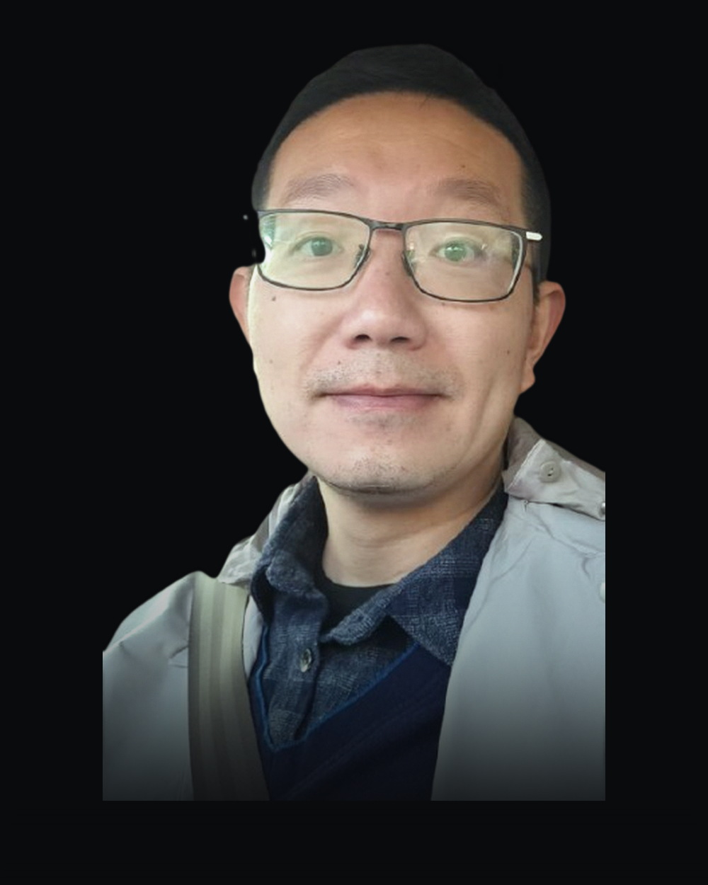 Lincoln Lin, founder and principal consultant, lit from one side against a dark field
