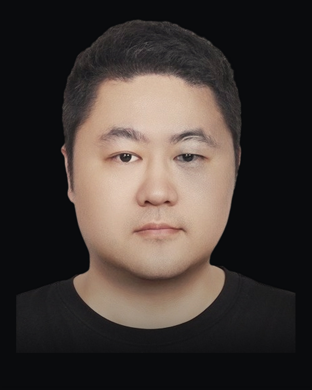 Mavin Wu, vice president of engineering technology, lit from one side against a dark field
